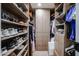 Organized walk-in closet with built-in shelving and ample storage space for clothing and accessories at 2236 E Blanche Dr, Phoenix, AZ 85022