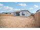 Home's rear view showcases a sizable backyard and covered patio at 22886 E Alyssa Rd, Queen Creek, AZ 85142