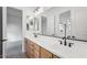 Double vanity bathroom with modern fixtures and a large mirror at 22886 E Alyssa Rd, Queen Creek, AZ 85142