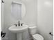 Powder room with pedestal sink and toilet at 22886 E Alyssa Rd, Queen Creek, AZ 85142