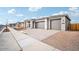 New construction home showcasing a three-car garage and attractive facade at 22886 E Alyssa Rd, Queen Creek, AZ 85142