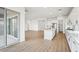 Spacious kitchen with white cabinetry, an island, and sliding glass doors at 22886 E Alyssa Rd, Queen Creek, AZ 85142