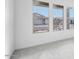 Bright living room with large windows and neutral colored carpet at 22886 E Alyssa Rd, Queen Creek, AZ 85142