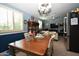 Dining room with blue walls, and a chandelier at 6313 W Onyx Ave, Glendale, AZ 85302