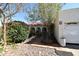 Charming front exterior featuring a well-maintained yard, arched entryway and mature landscaping at 6313 W Onyx Ave, Glendale, AZ 85302