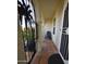 Inviting front porch with tiled flooring, wrought iron gate, and a comfortable chair at 6313 W Onyx Ave, Glendale, AZ 85302