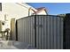 Side gate leading to garage, adorned with decorative metal artwork at 6313 W Onyx Ave, Glendale, AZ 85302