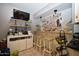 Modern dry bar with tile floors and a built-in television at 6313 W Onyx Ave, Glendale, AZ 85302