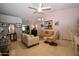 Cozy living room featuring tile flooring, a ceiling fan, and natural light at 6313 W Onyx Ave, Glendale, AZ 85302