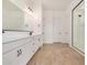 Bathroom featuring double vanity with sleek countertops, modern fixtures, and tile flooring at 12015 W Parkway Ln, Avondale, AZ 85323