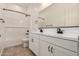 Elegant bathroom featuring a double vanity, modern fixtures, and a stylish shower-tub combo at 12015 W Parkway Ln, Avondale, AZ 85323