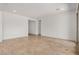 Minimalist bedroom with neutral tones, tile flooring, closet, and ample natural light at 12015 W Parkway Ln, Avondale, AZ 85323