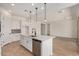 Spacious kitchen featuring a large island with a sink, stainless steel appliances, and abundant cabinet space at 12015 W Parkway Ln, Avondale, AZ 85323