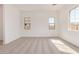 Bright living room with tile floors and large windows that bring in lots of natural light at 12015 W Parkway Ln, Avondale, AZ 85323