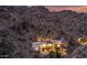 Aerial view of home nestled into the mountainside at 5676 E Cheney Dr, Paradise Valley, AZ 85253