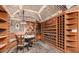 Extensive wine cellar with custom built-in shelving and tasting area at 5676 E Cheney Dr, Paradise Valley, AZ 85253