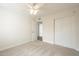 Bright bedroom with carpet, ceiling fan, closet, and attached bathroom, providing a comfortable and functional space at 18009 N 15Th Dr, Phoenix, AZ 85023