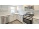 Close up of kitchen with stainless steel appliances, quartz countertops, and a stylish gas range at 18009 N 15Th Dr, Phoenix, AZ 85023