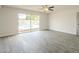 Bright living room with tile flooring, with sliding glass doors to the pool at 18009 N 15Th Dr, Phoenix, AZ 85023