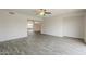 Open-concept living space with tile flooring and a ceiling fan, offering a versatile and inviting atmosphere at 18009 N 15Th Dr, Phoenix, AZ 85023