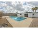 Backyard pool with updated patio and deck space, providing a refreshing outdoor retreat for relaxation and entertainment at 18009 N 15Th Dr, Phoenix, AZ 85023