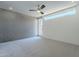 Bright bedroom with large window and ceiling fan at 520 S Roosevelt St # 1009, Tempe, AZ 85281