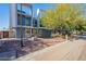 Modern building exterior with trees and sidewalk at 520 S Roosevelt St # 1009, Tempe, AZ 85281