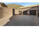 Exterior view of a stone garage with double doors at 12913 N 119Th St, Scottsdale, AZ 85259