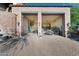Stone facade of a two-car garage with open doors at 12913 N 119Th St, Scottsdale, AZ 85259