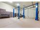 Spacious garage with car lifts and a classic car at 12913 N 119Th St, Scottsdale, AZ 85259