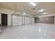 Triple-car garage with polished concrete floor at 12913 N 119Th St, Scottsdale, AZ 85259