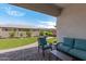 Relaxing backyard with patio furniture and grassy area at 22630 E Mewes Rd, Queen Creek, AZ 85142