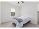 Comfortable bedroom with full bed, ceiling fan and window at 22630 E Mewes Rd, Queen Creek, AZ 85142