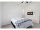 Spacious bedroom with a full-size bed and private access to the bathroom at 22630 E Mewes Rd, Queen Creek, AZ 85142
