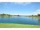 Serene community lake with a view of surrounding homes at 22630 E Mewes Rd, Queen Creek, AZ 85142