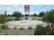 Scenic community lake with a water tower and surrounding landscape at 22630 E Mewes Rd, Queen Creek, AZ 85142