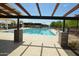 Inviting community lap pool with shaded seating areas at 22630 E Mewes Rd, Queen Creek, AZ 85142