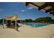 Resort-style community pool with shaded seating and a sun deck at 22630 E Mewes Rd, Queen Creek, AZ 85142