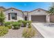 One-story home with two-car garage and landscaped front yard at 22630 E Mewes Rd, Queen Creek, AZ 85142