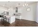 Open concept kitchen with island and stainless steel appliances at 22630 E Mewes Rd, Queen Creek, AZ 85142