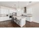 Spacious kitchen with white cabinets and granite countertops at 22630 E Mewes Rd, Queen Creek, AZ 85142