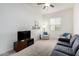 Living room featuring comfortable seating and a TV at 22630 E Mewes Rd, Queen Creek, AZ 85142
