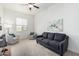 Living room with sofa, armchairs and wall art at 22630 E Mewes Rd, Queen Creek, AZ 85142