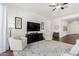 Living area with comfy seating and entertainment center at 22630 E Mewes Rd, Queen Creek, AZ 85142