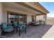 Covered patio with seating area and built-in grill at 22630 E Mewes Rd, Queen Creek, AZ 85142