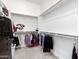Large walk-in closet with ample shelving and hanging space at 22630 E Mewes Rd, Queen Creek, AZ 85142