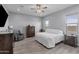 Bright bedroom with natural light, features ensuite and wood look tile flooring at 12204 W Blackhawk Rd, Casa Grande, AZ 85194