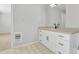 Updated bathroom with white cabinets and a beige countertop at 748 W Coolidge St, Phoenix, AZ 85013