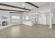 Bright living room with fireplace, wood beams, and tile floors at 748 W Coolidge St, Phoenix, AZ 85013