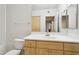 Clean bathroom with light wood vanity and a large mirror at 7575 E Indian Bend Rd # 2081, Scottsdale, AZ 85250